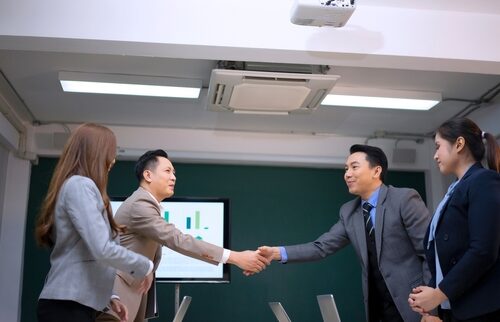 Angel investor and startup founder connecting, symbolizing private equity funding and early-stage investment through a self-directed IRA.
